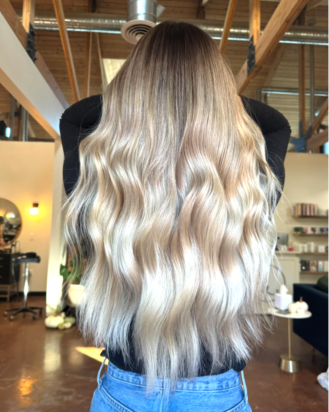 Long blonde balayage with darker root by Ashlyn