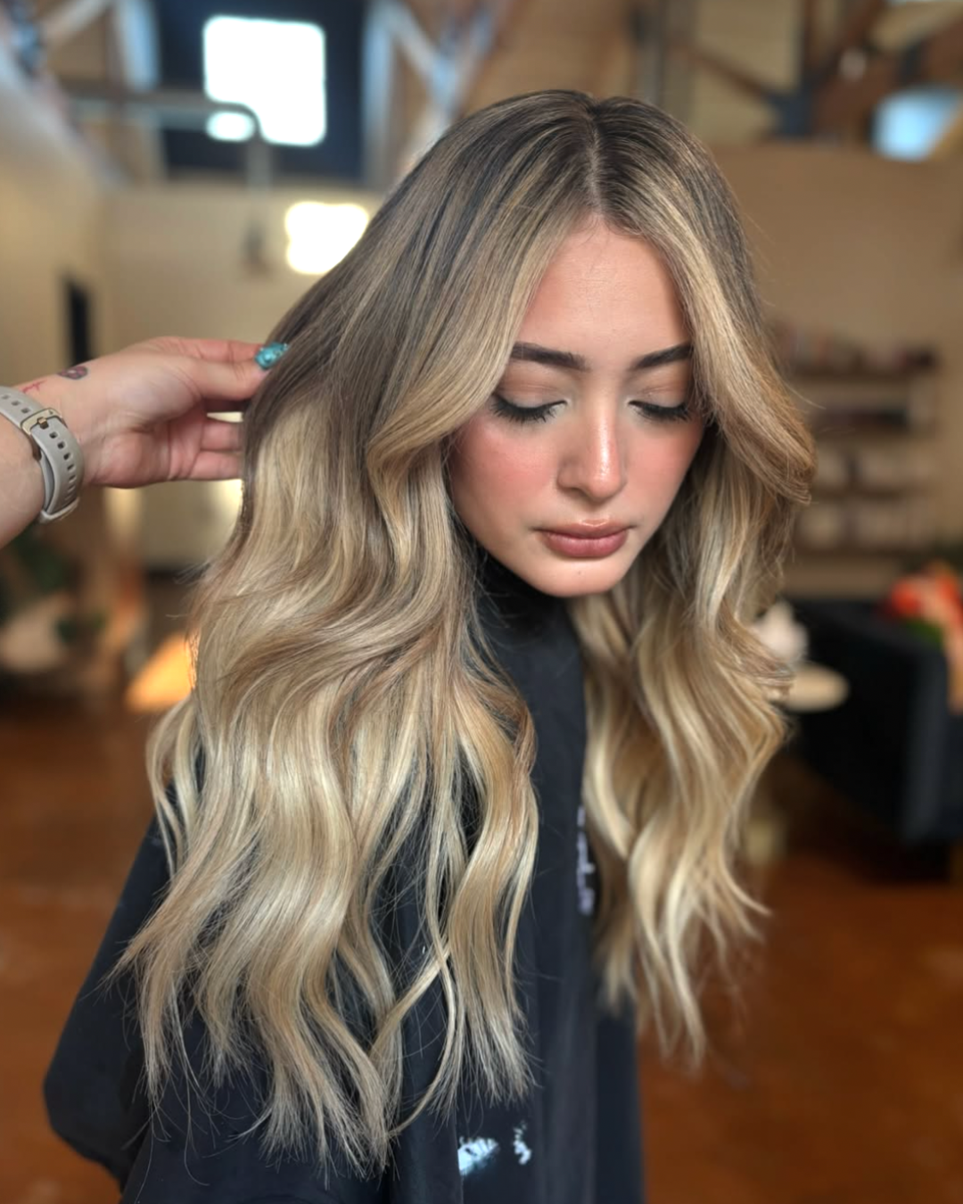Long blonde balayage with an ashy bronde root by Selene