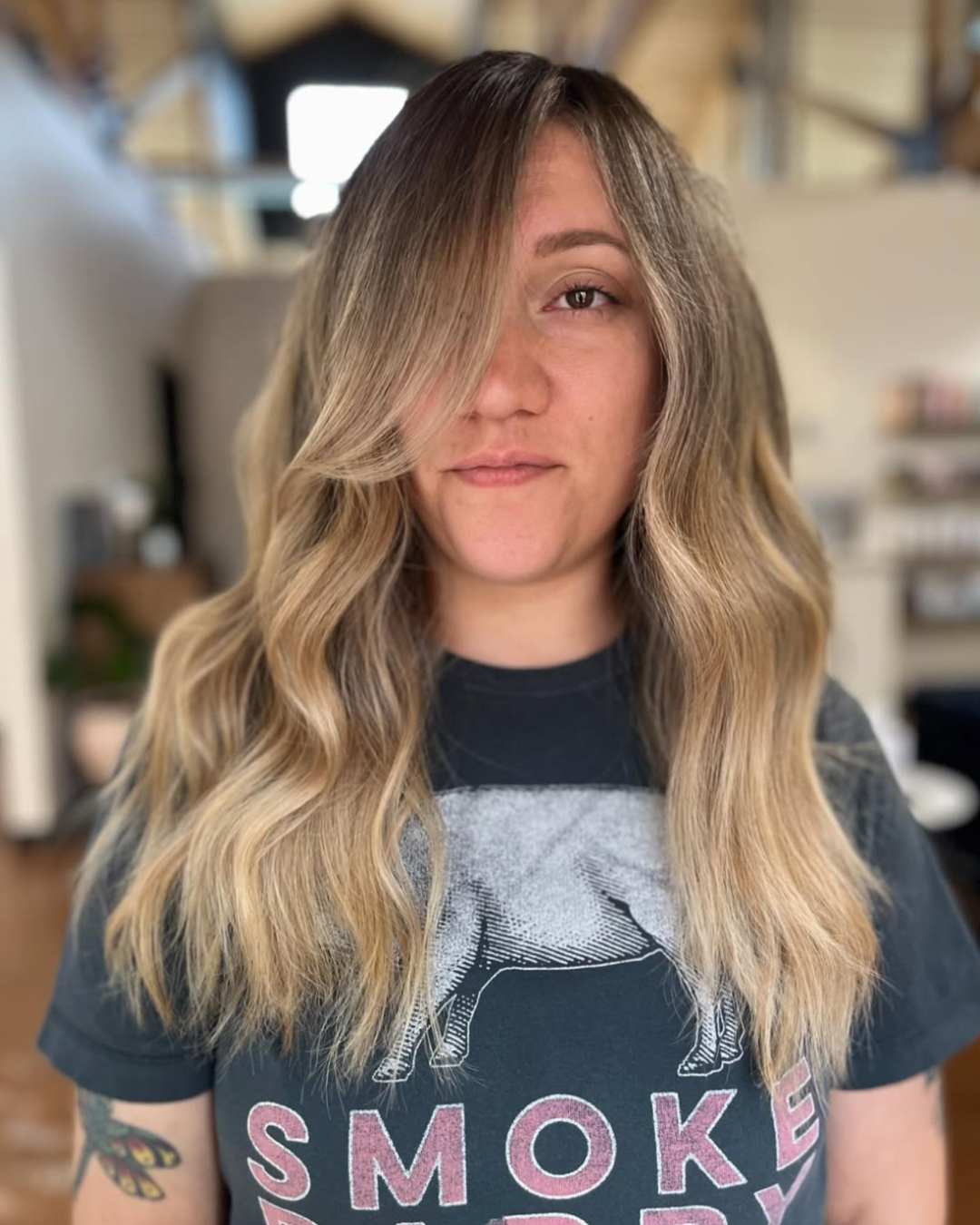 Chest length toffee blonde hair with a darker root by Ashlyn