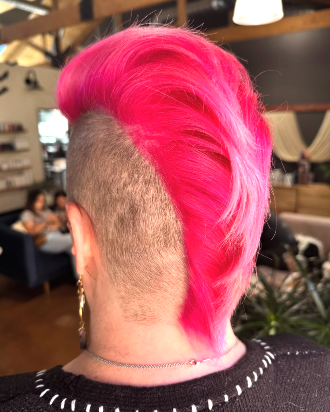 Back view of a vivid, bright pink mohawk